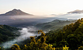 Panoramic view of Mount Batur and Batur Lake at sunrise from Kintamani, Bali, Indonesia