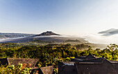 Panoramic view of Mount Batur and Batur Lake at sunrise from Kintamani, Bali, Indonesia