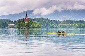 Canoeists on Lake Bled, Julian Alps, Gorenjska, Slovenia, Europe