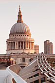 Millennium Bridge and St. Paul's Cathedral at sunrise, London, England, United Kingdom, Europe