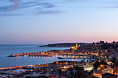 A cityscape of Menton at dusk, Provence-Alpes-Cote d'Azur, French Riviera, France, Mediterranean, Europe