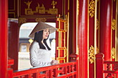 Woman wearing Ao Dai dress in Imperial Palace inside Citadel, Hue, Thua Thien-Hue, Vietnam, Indochina, Southeast Asia, Asia