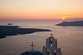 Sunset over the caldera, typical church in foreground, Firostefani, Santorini (Thira) (Thera), Cyclades Islands, South Aegean, Greek Islands, Greece, Europe