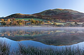 Mist burning off Loweswater on a frosty autumn morning, Lake District National Park, Cumbria, England, United Kingdom, Europe