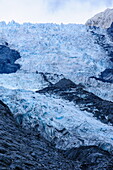 Tourists hiking on the Franz-Joseph Glacier, Westland Tai Poutini National Park, Southern Alps, UNESCO World Heritage Site, South Island, New Zealand, Pacific