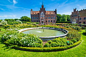 Fountain and roses in front of Castle Egeskov, Denmark, Scandinavia, Europe