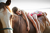 Two girls on horse back at lake Starnberg, Upper Bavaria, Bavaria, Germany