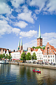 View over river Trave to historic city with churches of St. Peter and St. Mary, Lubeck, Schleswig-Holstein, Germany