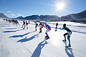 Female ice speed skaters on lake Weissensee, Alternative Eleven cities tour, Weissensee, Carinthia, Austria