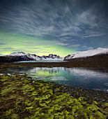 Skardatindur, Moss covered landscape and northern lights, Skaftafellsjokull, Skaftafell, South Island, Island