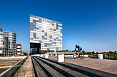 Cyclist, Hyatt Hotel, Media harbour, Duesseldorf, North Rhine Westphalia, Germany