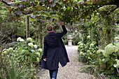 Woman in an English garden, Rockwood, Newbury, West Berkshire, England, United Kingdom