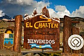 El Chalten village welcome sign, with shape of famous peak FitzRoy, Parque Nacional Los Glaciares, Patagonia, Argentina.