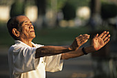 Vietnam, Ho Chi Minh Ville (Saigon), Old man practising Tai chi chuan.