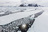 The sun reflected in an open lead in Active Sound, Weddell Sea, Antarctica.