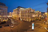 Opera house building at night, Vienna, Austria.