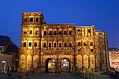 Porta nigra, ancient city gate, World Heritage Site, illuminated at night, Trier, Germany