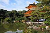 Kinkaku-ji, Kyoto, Japan  The Golden Pavilion, or Kinkaku, is a three-story building on the grounds of the temple  The top two stories of the pavilion are covered with pure gold leaf  The pavilion functions as a shariden, housing relics of the Buddha  On 