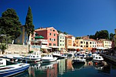Colorful houses surrounding picturesque little port of Veli Losinj on Losinj Island, Croatia