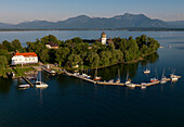 Aerial shot of Hotel Restaurant Inselwirt, Fraueninsel, lake Chiemsee, Bavaria, Germany