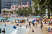 Hawaii, Hawaiian, Honolulu, Waikiki Beach, Pacific Ocean, Kuhio Beach Park, Royal Hawaiian, pink, hotel, waterfront, sunbathers, sand, swimmers, bathers, Waikiki Bay.