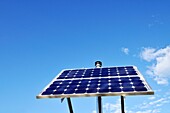 Renewable energy solar collector panel against clear blue sky