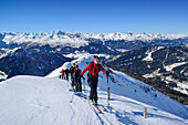 Several persons back-country skiing ascending towards Gammerspitze, Stubai Alps with Habicht and Serles in the background, Gammerspitze, valley of Schmirn, Zillertal Alps, Tyrol, Austria