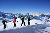 Several persons back-country skiing ascending towards Kleiner Kaserer, Hohe Warte and Stubai Alps in the background, Kleiner Kaserer, valley of Schmirn, Zillertal Alps, Tyrol, Austria