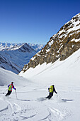 Two persons back-country skiing downhill from Kleiner Kaserer, Kleiner Kaserer, valley of Schmirn, Zillertal Alps, Tyrol, Austria