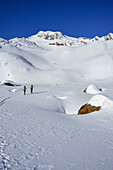 Two persons back-country skiing ascending towards Schneespitze, Schneespitze, valley of Pflersch, Stubai Alps, South Tyrol, Italy