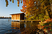 Boat houses at lake Wesslinger See in Autumn, indian summer, Starnberg five lakes region, district Starnberg, Bavarian alpine foreland, Upper Bavaria, Bavaria, Germany, Europe