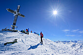 Several persons back-country skiing standing at summit of Gilfert, Gilfert, Tux Alps, Tyrol, Austria