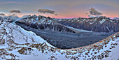 Hut with alpenglow over Malte Brun and Liebig Range, Mount Cook National Park, New Zealand