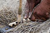 Kalahari bushmen making fire, Makgadikgadi Pans, Kalahari Desert, Botswana