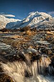 Stream flows into Tasman River, Ben Ohau Range, Mount Cook National Park, New Zealand