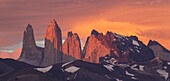 Storm clouds at sunrise above Torres del Paine as seens from Azul Lagoon, Torres del Paine National Park, Chile