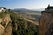 View from the bridge into the gorge and to the Sierra de Ronda, Ronda, Malaga province, Andalusia, Spain