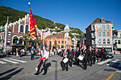 Parade through Bryggen district, Bergen, Hordaland, Norway
