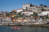 Sightseeing boat on Douro river and Ribeira old town and historical center, Porto, Norte, Portugal