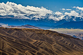 Desert landscape with boulders mountains, snow-covered Tien Shan mountains in the background, Kolsay Lakes National Park, Tien Shan Mountains, Tian Shan, Almaty region, Kazakhstan, Central Asia, Asia