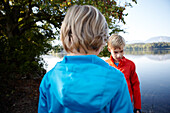 Two boys by the lake Staffelsee, Seehausen, Upper Bavaria, Germany