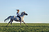 girl on a galloping horse, Freising, Bavaria, Germany