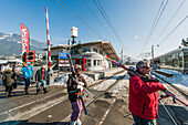 Skiers on the way to the Hahnenkamm lift, Kitzbuehel, Tyrol, Austria, Europe