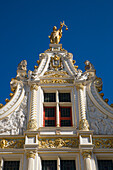 Gilded statues on an old Civil Registry building, Bruges (Brugge), Flemish Region, Belgium