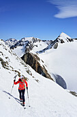 Woman back-country skiing ascending towards Similaun, Marzellspitze in background, Similaun, valley of Pfossental, valley of Schnalstal, Vinschgau, Oetztal Alps, South Tyrol, Italy