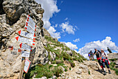 Several persons hiking on path, Rotwand, Rosengarten, UNESCO world heritage Dolomites, Dolomites, Trentino, Italy