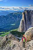 Woman descending on fixed rope route from Rotwand, Rotwand, Rosengarten, UNESCO world heritage Dolomites, Dolomites, Trentino, Italy