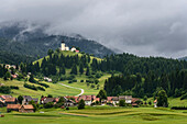 Village at base of rolling landscape, Retje, Notranjska, Slovenia, Retje, Notranjska, Slovenia