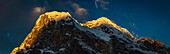Sun setting over snowy mountaintop, Lukla, Khumbu, Nepal, Lukla, Khumbu, Nepal