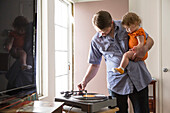 Caucasian father playing records with daughter, Los Angeles, California, USA